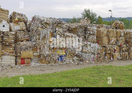 Paper and carboard carton material stacked for recycling Stock Photo