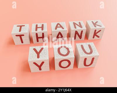 Cubes en bois peints en blanc avec des lettres rouges disposées en mots de remerciement sur fond rose Banque D'Images