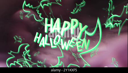 Image de texte Happy halloween et fantômes verts fond rose Banque D'Images