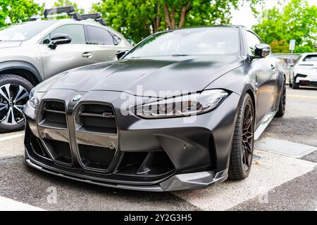 Seattle, WA, États-Unis - 22 juillet 2024 : compétition BMW M4 noir mat. BMW, est une multinationale allemande de véhicules et de motos de luxe. BMW Banque D'Images