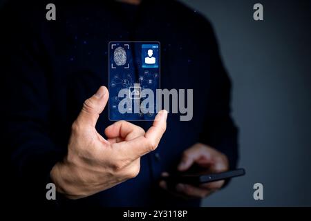 Main d'homme d'affaires tenant la carte d'identification numérique et le réseau technologique et la communication avec la ligne et le concept d'affaires. Banque D'Images