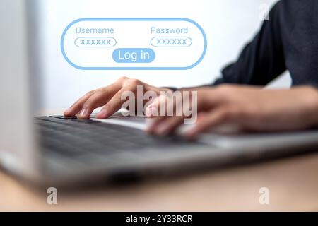 Gros plan d'une personne utilisant un ordinateur portable avec un écran de connexion affiché. Concept de confidentialité et de sécurité. Banque D'Images