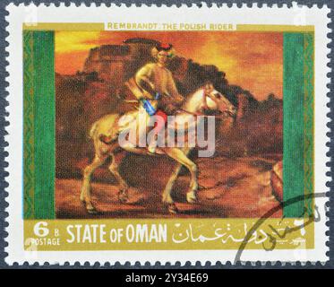 Timbre-poste oblitéré imprimé par Oman, qui montre la peinture de Rembrandt - le cavalier polonais, vers 1968. Banque D'Images