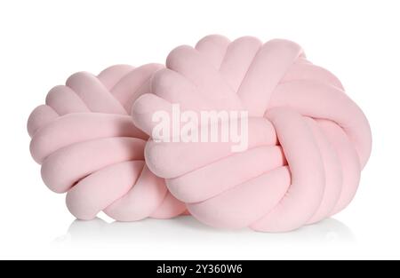 Coussins roses en forme de noeud isolés sur blanc Banque D'Images