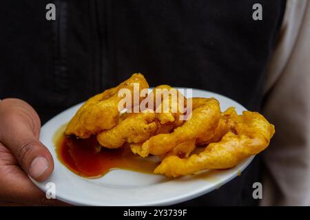 Les picarones péruviennes sont un dessert traditionnel couramment trouvé au Pérou. Ils sont un type de beignet fait à partir d'une pâte de patate douce et de citrouille, qui est Banque D'Images