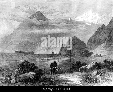 Paysage ferroviaire du Mont Cenis : la vallée de la Dora, près d'Oulx, 1871. 'L'ouverture du grand tunnel ferroviaire à travers les Alpes entre Savoie et Piémont, le 17 septembre, a été suivie, cette semaine, par l'ouverture de la courte ligne de l'embouchure du tunnel à la gare Modane de Paris, Lyon, et la ligne de Mediterranean Company en Savoie, ce qui signifie qu'il y aura désormais un trafic ininterrompu de marchandises et de passagers entre la France et l'Italie...[Voir les spectacles] le paysage du versant italien du Mont Cenis, le Col de clair&#Xe9;e et le Mont Gen&#Xe8;vre, où descend la Dora Riparia Banque D'Images