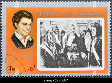 Timbre-poste oblitéré imprimé par Fujairah (Fujeira), qui montre la star de cinéma - Gérard Philipe, vers 1972. Banque D'Images