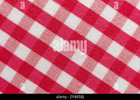 La texture du tissu de lin dans une grande cage de rose et blanc. Matériau de confection écossais. Tissu à carreaux Banque D'Images