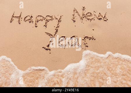 inscription bonne année au bord de la mer Banque D'Images