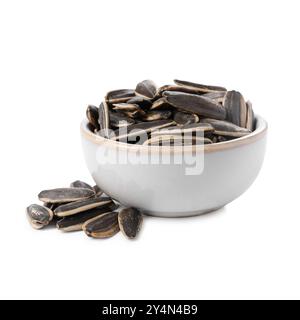 Graines de tournesol dans un bol isolé sur blanc Banque D'Images
