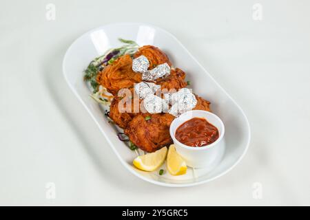 Chicken Lollipop est un apéritif chinois indien qui est une ailette de poulet frenched Banque D'Images