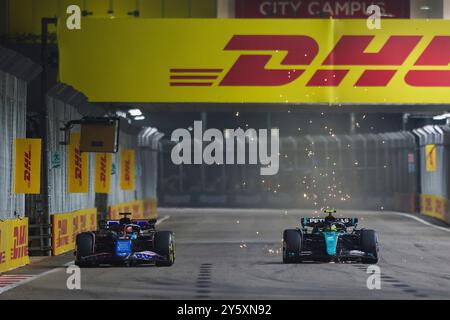 Singapour, Singapour. 22 septembre 2024. #31 Esteban Ocon (FRA, BWT Alpine F1 Team), #44 Lewis Hamilton (GBR, Mercedes-AMG Petronas F1 Team), Grand Prix F1 de Singapour au Marina Bay Street circuit le 22 septembre 2024 à Singapour, Singapour. (Photo de HOCH Zwei) crédit : dpa/Alamy Live News Banque D'Images