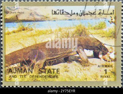 Timbre-poste oblitéré imprimé par Ajman, qui montre Varaan, vers 1973. Banque D'Images