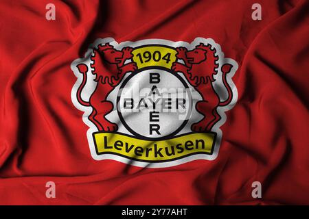Pringsewu, Lampung ; 1er octobre 2024 ; texture du logo du drapeau à foyer sélectif leverkusen fond de club de football, illustration 3D. Banque D'Images
