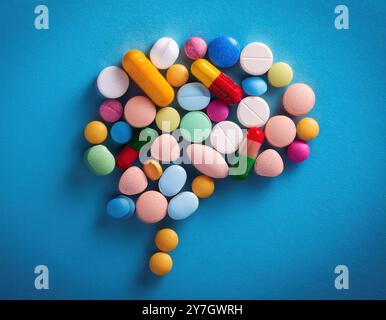 Un assortiment de diverses pilules et capsules, représentant la complexité et la variété des médicaments utilisés dans la guérison mentale Banque D'Images