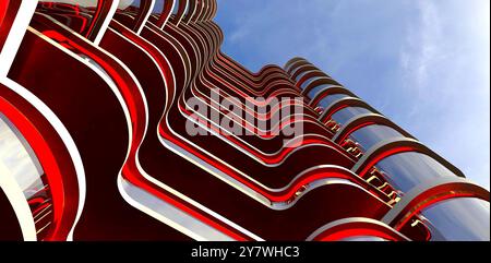 Éclairage LED rouge sur la façade d'un prestigieux condominium à Canberra. Vue de dessous. Rendu 3D.. Banque D'Images