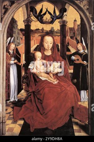 MEMLING, Hans (né vers 1440, Seligenstadt, d. 1494, Bruges) Vierge à l'enfant intronisé avec deux anges musicaux 1465-67 huile sur panneau de chêne, 75,4 x 52,3 cm Nelson-Atkins Museum of Art, Kansas City malgré quelques signes d'usure, cette peinture est une œuvre clé dans notre compréhension des débuts de Memling en tant que maître à part entière. Peu étudié jusqu'à récemment, il a longtemps été considéré comme l'une des premières œuvres de Memling, une peinture jeune datant d'avant 1468 qui pourrait être une copie d'après Rogier van der Weyden. C'est la Vierge la plus rogiérienne jamais faite par Memling. Le d tendu Banque D'Images