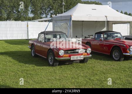 Copenhague, Danemark, le 2 août 2024 : une TR6 rouge vintage au Grand Prix historique de Copenhague, en Europe Banque D'Images