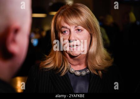 Vilnius, Lituanie. 13 octobre 2024. Vilija Blinkeviciute, chef du Parti social-démocrate lituanien (LSDP), s’adresse aux médias lors d’une élection. Le vote au premier tour des élections législatives en Lituanie est terminé. Les premiers résultats du dépouillement des votes montrent que le Parti social-démocrate lituanien (LSDP), parti d'opposition, est en tête. (Photo de Yauhen Yerchak/SOPA images/SIPA USA) crédit : SIPA USA/Alamy Live News Banque D'Images