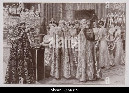 Couronnement du roi George V. couronnement de la reine Mary. Agenouillée à son prie-Dieu, elle reçoit la couronne de l'archevêque de Cantorbéry. Londres. 1911 le couronnement de la reine suit celui du roi. Elle s'agenouille devant un prie-Dieu devant l'autel. L’archevêque oint son front avec l’huile sainte, puis place un anneau d’or sur l’annulaire de sa main droite, et enfin place la couronne sur sa tête – « une couronne de gloire, d’honneur et de vertu ». Banque D'Images