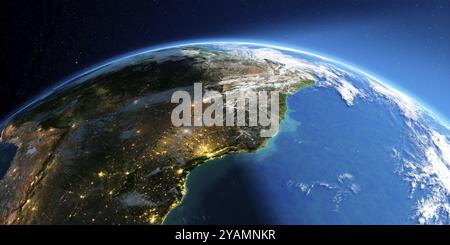 Une Terre très détaillée avec atmosphère, relief exagéré et villes inondées de lumière. Transition de la nuit au jour. Amérique du Sud. Côte est du Brésil. Banque D'Images