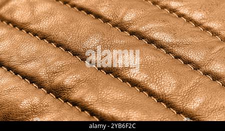 Fond de texture en cuir macro shot. Fait partie des détails en cuir marron perforé. Fond de texture en cuir perforé. Cuir texturé Banque D'Images