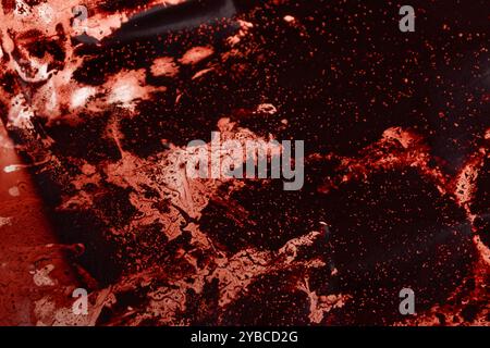 fond abstrait avec une surface corrodée de couleur rouge, gros plan Banque D'Images