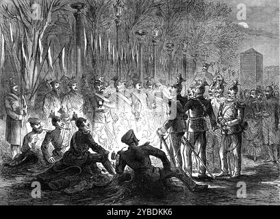 Les Allemands à Paris : bivouac d'Uhlans dans les champs Elys&#xe9;es, 1871. Guerre franco-prussienne. 'Les Bavarois étaient cantonnés ici au Palais de l'industrie, et les Prussiens dans le Cirque Imperiale... les troupes allemandes avaient piqué leurs chevaux en longues lignes entre les arbres ; les bataillons d'infanterie avaient enlevé leurs sacs à dos, empilé les armes, échangé leurs casques pointus contre des casquettes, et cuisinaient leurs dîners parmi les restes fanés d'arbustes exotiques... dans les rues latérales pourraient être vus des soldats à pied et à cheval à la recherche de leurs logements avec la délibération particulière au G Banque D'Images