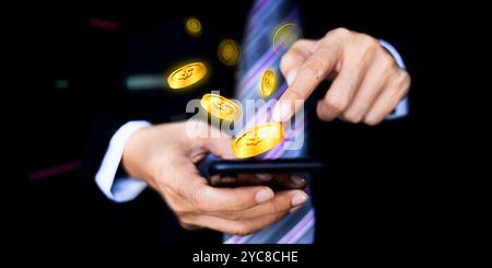 Homme d'affaires et tenant des téléphones intelligents et tirer la vidéo comme chute d'argent. Utilisation du smartphone avec l'icône Dollar dans l'écran virtuel Banque D'Images