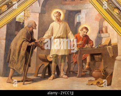 VOGHERA, ITALIE - 12 SEPTEMBRE 2024 : la fresque de réunissent Joseph et jeune Jésus et réunissent Anthony l'Abbé à Domo - Collegiata di San Lorenzo Banque D'Images