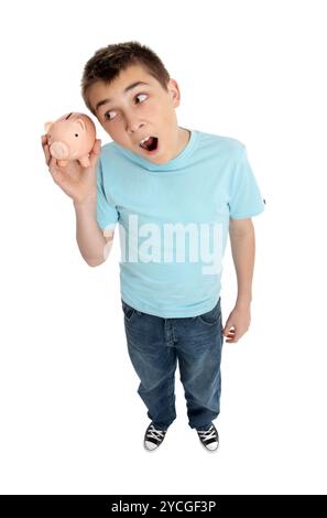 Surpris boy shaking money box Banque D'Images