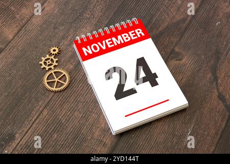 Le 24 novembre est commémoré en tant que Journée mondiale des jumelles conjointes avec un arrière-plan de calendrier en bois Banque D'Images