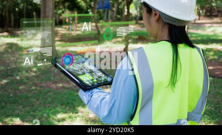 Concepts ESG pour l'environnement, la société et la gouvernance. Femme ingénieur utilise ipad pour analyser ESG dans le concept de stratégie d'investissement d'entreprise. Qui le scre Banque D'Images