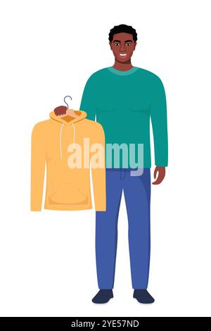 Souriant jeune homme noir tenant un cintre avec un sweat à capuche jaune. Choix du concept de vêtements. Illustration vectorielle dans un style plat Illustration de Vecteur