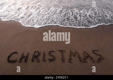 Inscription de Noël 2005 sur la plage d'été Banque D'Images