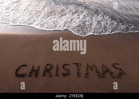 Inscription de Noël 2005 sur la plage d'été Banque D'Images