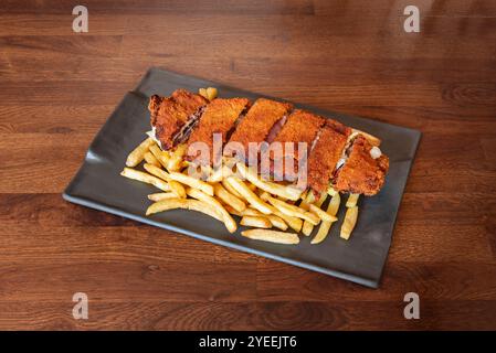 Le mot « cachopo » fait référence aux troncs d’arbres creux qui étaient utilisés comme conteneurs, et il a été nommé de cette façon en raison de la similitude avec les deux stu Banque D'Images