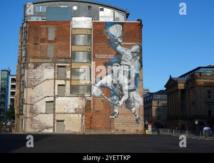 Murale sur le côté pignon du bâtiment du centre-ville représentant les Jeux du Commonwealth de 2014, Glasgow, Écosse Banque D'Images