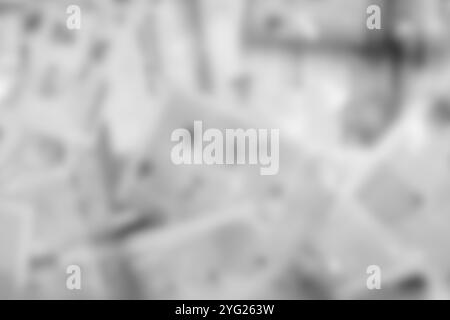 Beaucoup de vieux journaux sur la surface horizontale. Texture d'arrière-plan, vue de dessus, flou Banque D'Images