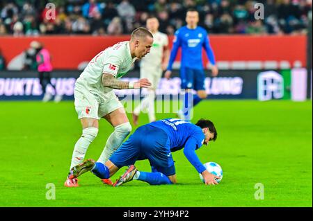 GER, Bayern, Augsburg, Fussball, FC Augsburg - TSG Hoffenheim, in der WWK Arena, Augsburg, 10. Spieltag, 10.11.24, v.l. phillip Tietz (FC Augsburg, 21), Florian Grillitsch (TSG Hoffenheim, 11), Zweikampf, Foul DFL/DFB réglementations interdisent toute utilisation de photographies comme séquences d'images et/ou quasi-vidéo, Banque D'Images