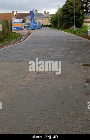 Sur ce qui était des allocations et ensuite planifié comme logement social est maintenant développé comme une petite poignée de maisons contemporaines exclusives et hautement spécifiées Banque D'Images