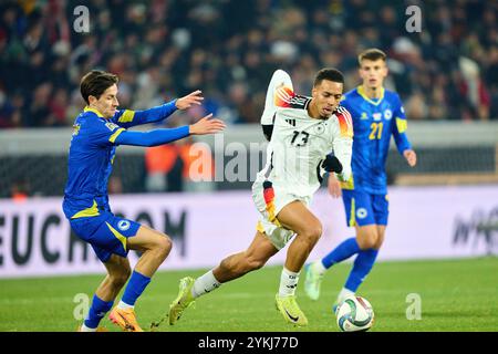 Felix Nmecha, DFB 13 Competition for the ball, tackling, duel, header, zweikampf, action, combat contre Ivan Basic, Bosnien-Herzégovine Nr. 13 dans l'UEFA Nations League 2024 match ALLEMAGNE - BOSNIE HERZÉGOVINE 7-0 dans la saison 2024/2025 au 16 novembre 2024 à Fribourg, Allemagne. Photographe : Peter Schatz Banque D'Images