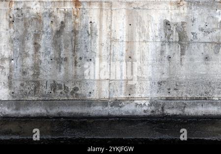 Mur de béton gris grungy, texture de photo de fond, vue de face Banque D'Images