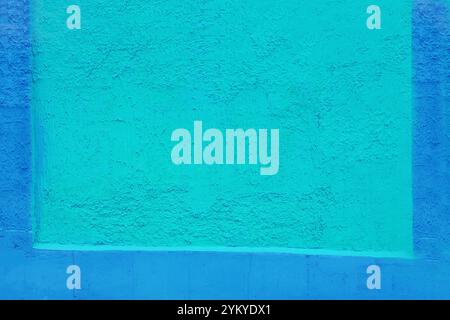 Fragment d'un mur peint en vert et bleu. Banque D'Images
