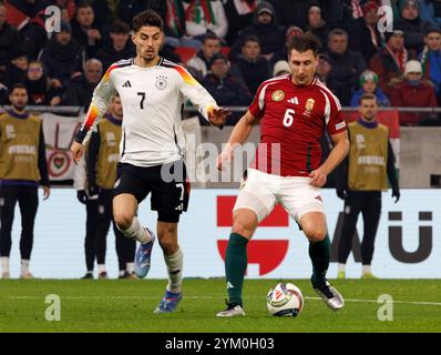 Budapest, Hongrie. 19 novembre 2024. L'Allemand Kai Havertz affronte l'Hongrois Willi Orban lors du match de l'UEFA Nations League 2024/25 League A Group A3 entre la Hongrie et l'Allemagne à la Puskas Arena le 19 novembre 2024 à Budapest, Hongrie. Crédit : Laszlo Szirtesi/Alamy Live News Banque D'Images