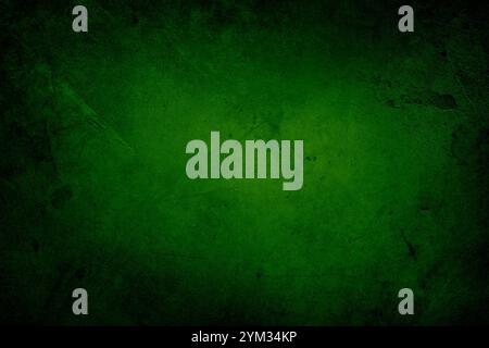 Fond de mur en béton texturé vert. Bords sombres Banque D'Images