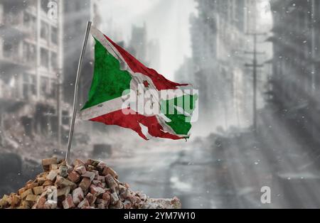 Drapeau burundais sale et déchiré, symbole de résistance et de victoire. Une scène de guerre et de dévastation, les ruines d'une ville détruite par les conflits. Rendu 3D. Banque D'Images