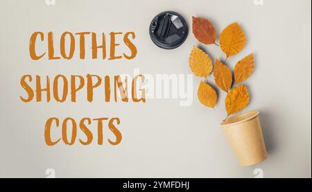 Plante feuillue est sur le dessus d'un fond blanc avec les mots Clothes shopping Costs écrit en dessous Banque D'Images