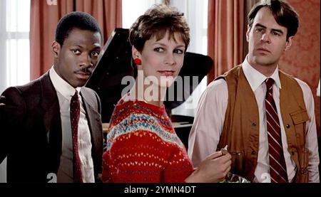 TRADING PLACES 1983 film Paramount Pictures avec de gauche à droite : Eddie Murphy, Jamie Lee Curtis, Dan Aykroyd Banque D'Images