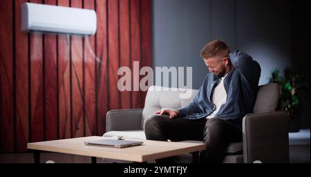 Climatiseur mal de cou problème de douleur dans le salon Banque D'Images